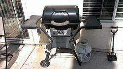 Lawn mower and BBQ grill.-image-467381449.jpg