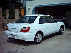 My Aspen White 2002 WRX Sedan-rear-passenger-side-3-27-04-resized-.jpg