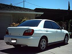 My Aspen White 2002 WRX Sedan-rear-passenger-side-7-3-04-resized-.jpg