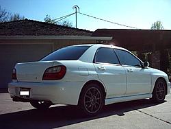 My Aspen White 2002 WRX Sedan-rear-passenger-side-3-12-05-resized-.jpg
